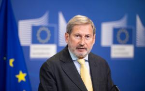 Johannes Hahn, responsible for Budget and Administration, speaking at a podium with the European Commission's logo in the background