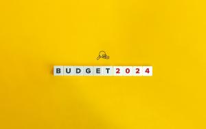 Budget 2024 written with Scrabble letters with a yellow background